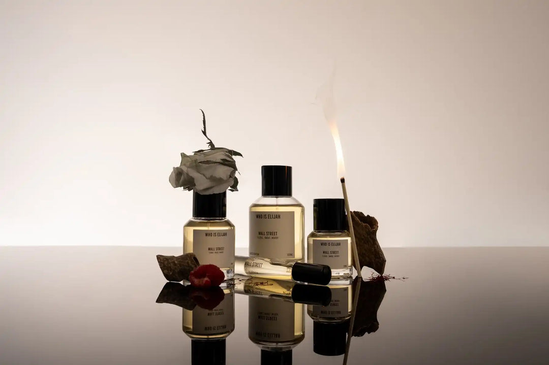 Three perfume bottles with black caps.